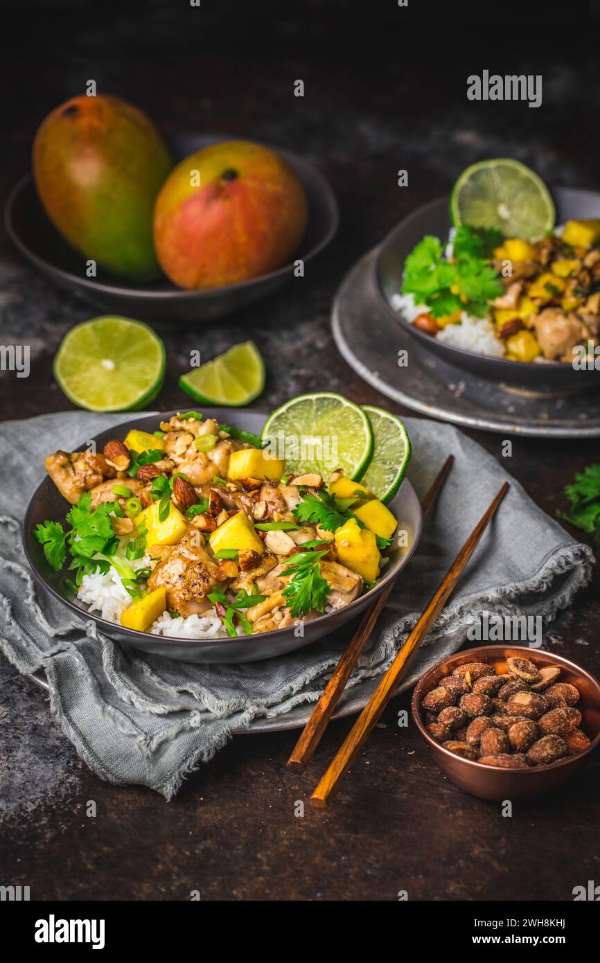 Chicken and Mango stir fry with sliced lime and coriander, in dark