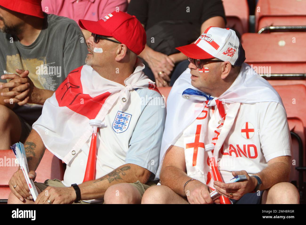 Two male England Lionesses fans wear England flags and caps England v Northern Ireland UEFA Womens Euro 15 July 2022 St Marys Stadium Southampton Stock Photo