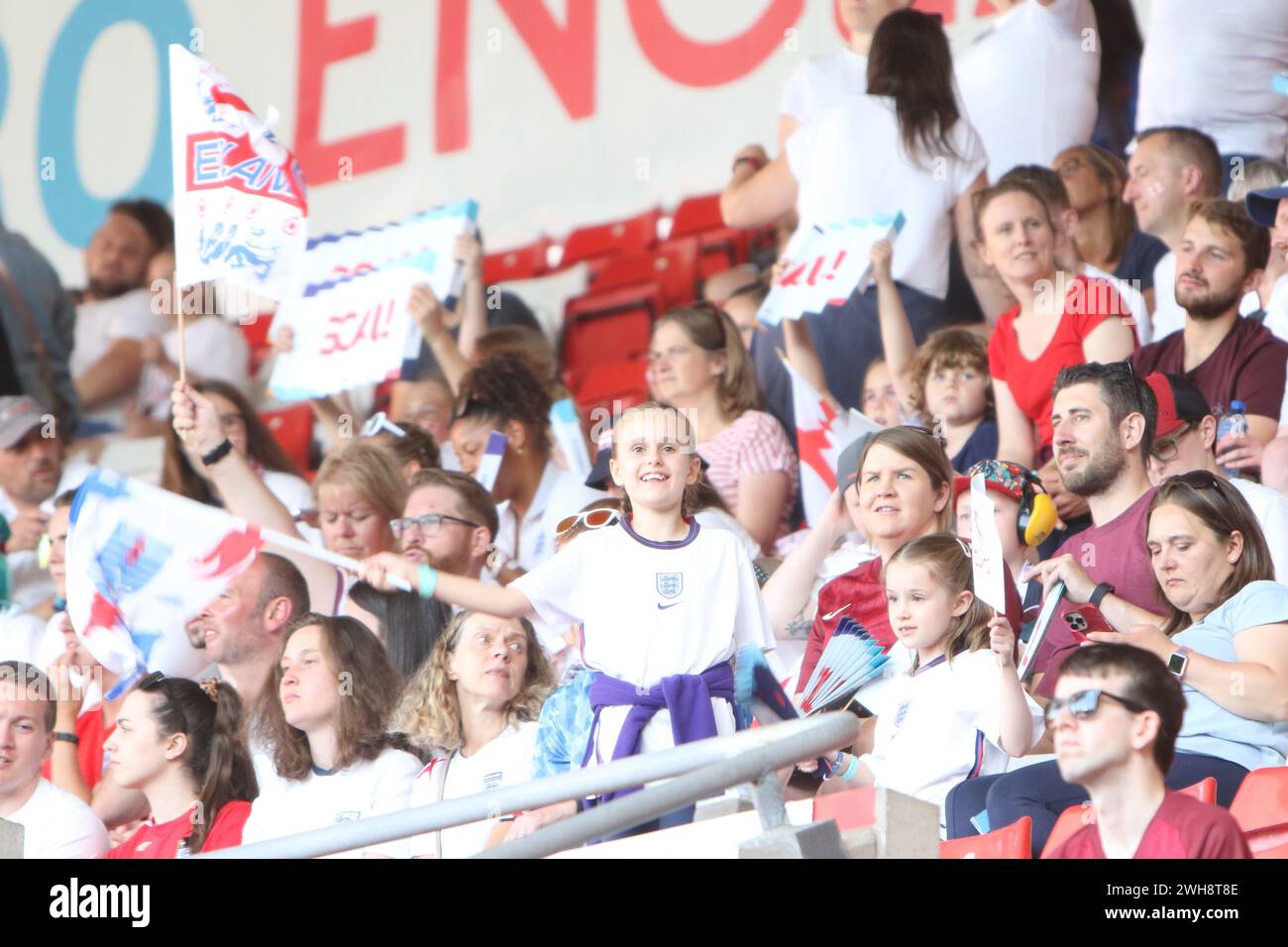 Young England Lionesses fans wave flags England v Northern Ireland UEFA Womens Euro 15 July 2022 St Marys Stadium Southampton Stock Photo