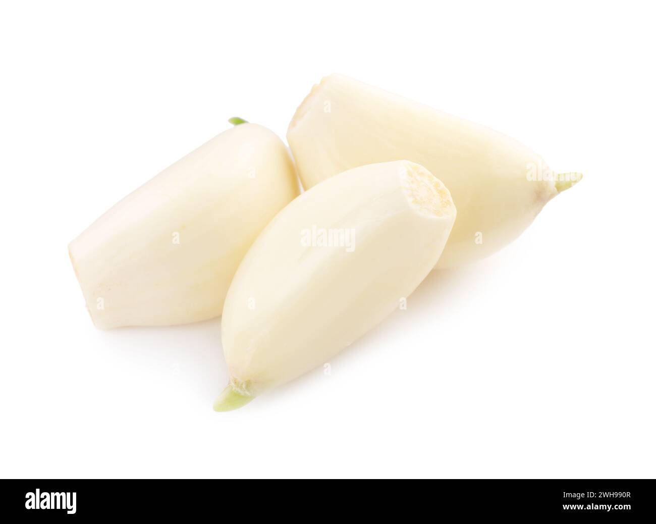 Peeled cloves of garlic isolated on white Stock Photo - Alamy