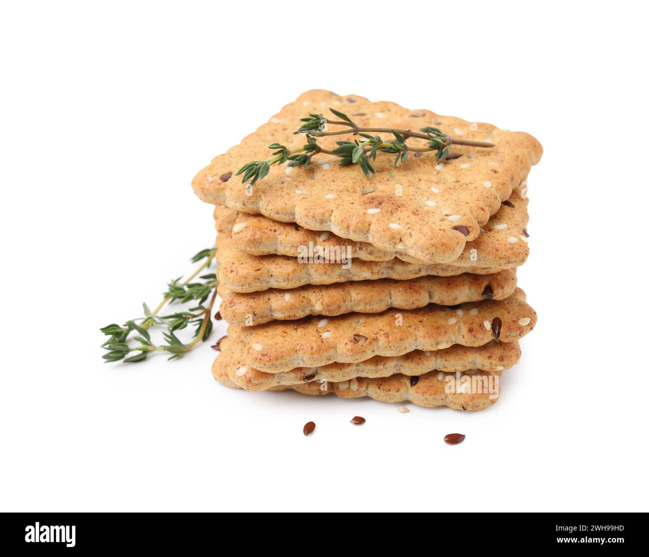 Stack of cereal crackers with flax, sesame seeds and thyme isolated on ...