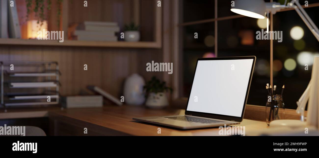 Side view image of a modern and cozy home office workspace at night ...