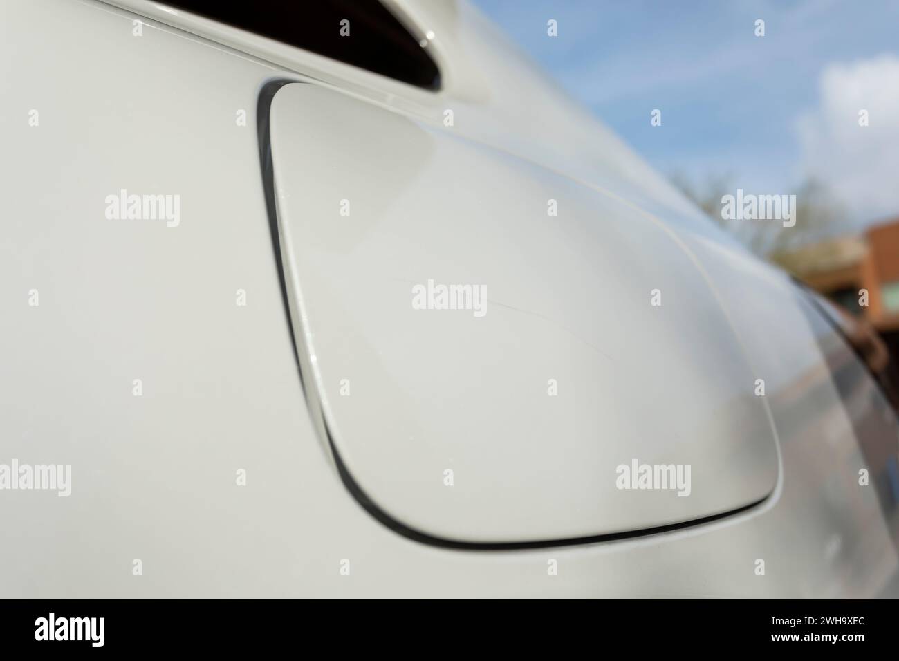 Closeup Scratch On Cap Of Filler Neck, Gas Tank Of White Car. Paint Or