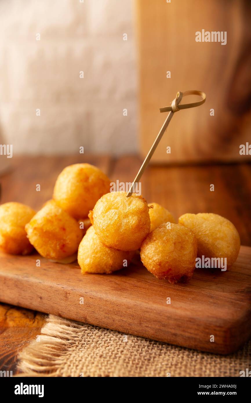 Fried breaded cheese balls, easy and delicious homemade snack recipe. Stock Photo