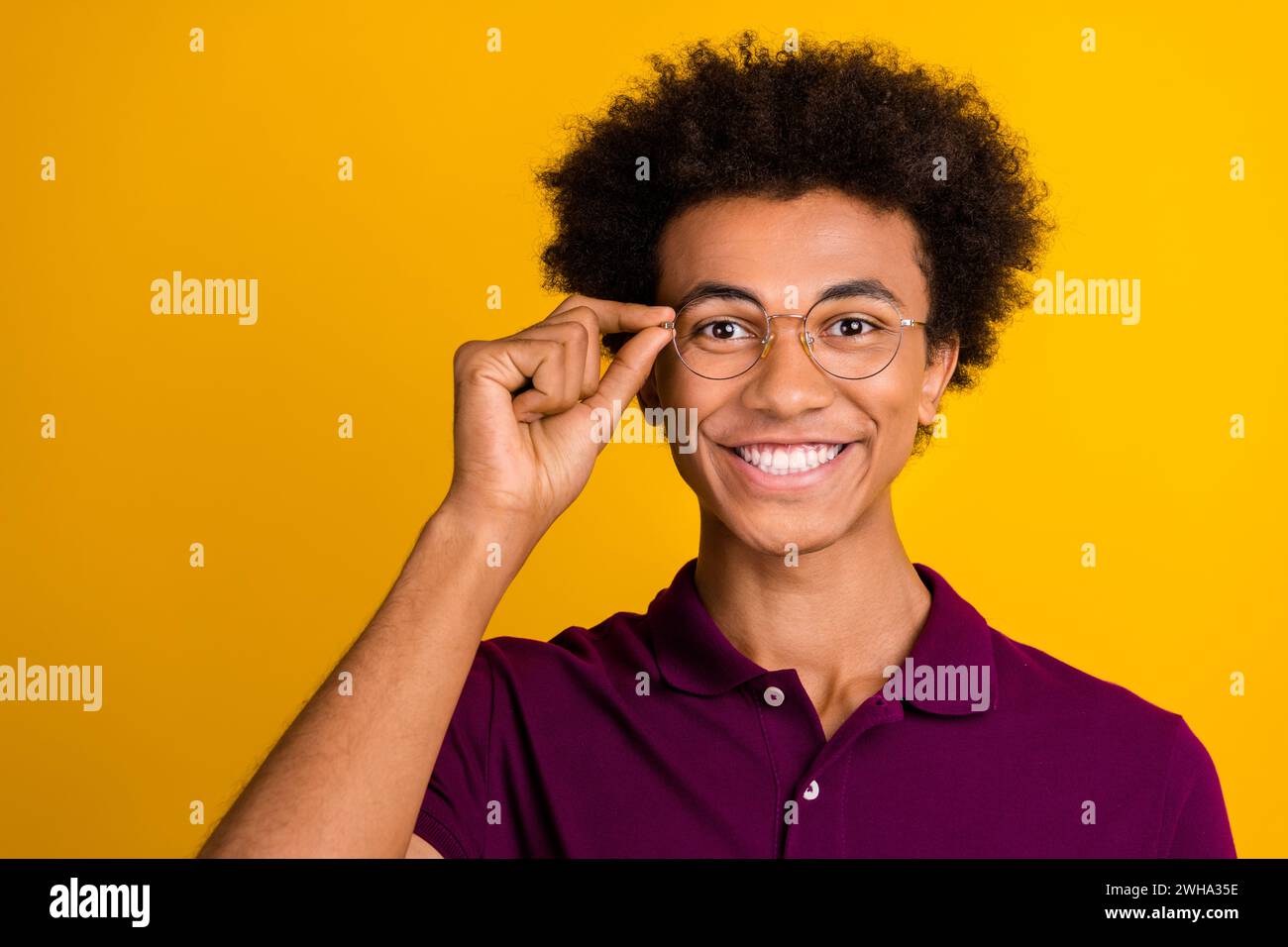 Photo of positive glad man wear purple clothes hand hold glasses ...