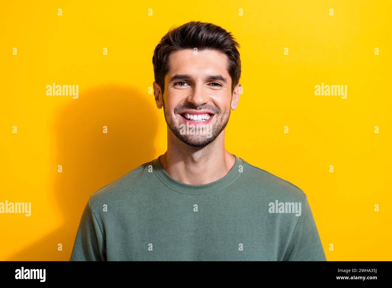 Portrait of toothy beaming positive guy with stubble brunet hair wear ...