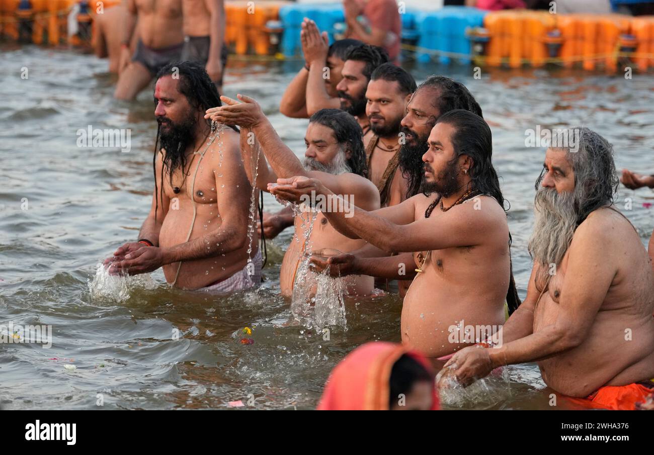 Hindu devotee offers prayers after taking holy dips at Sangam, the