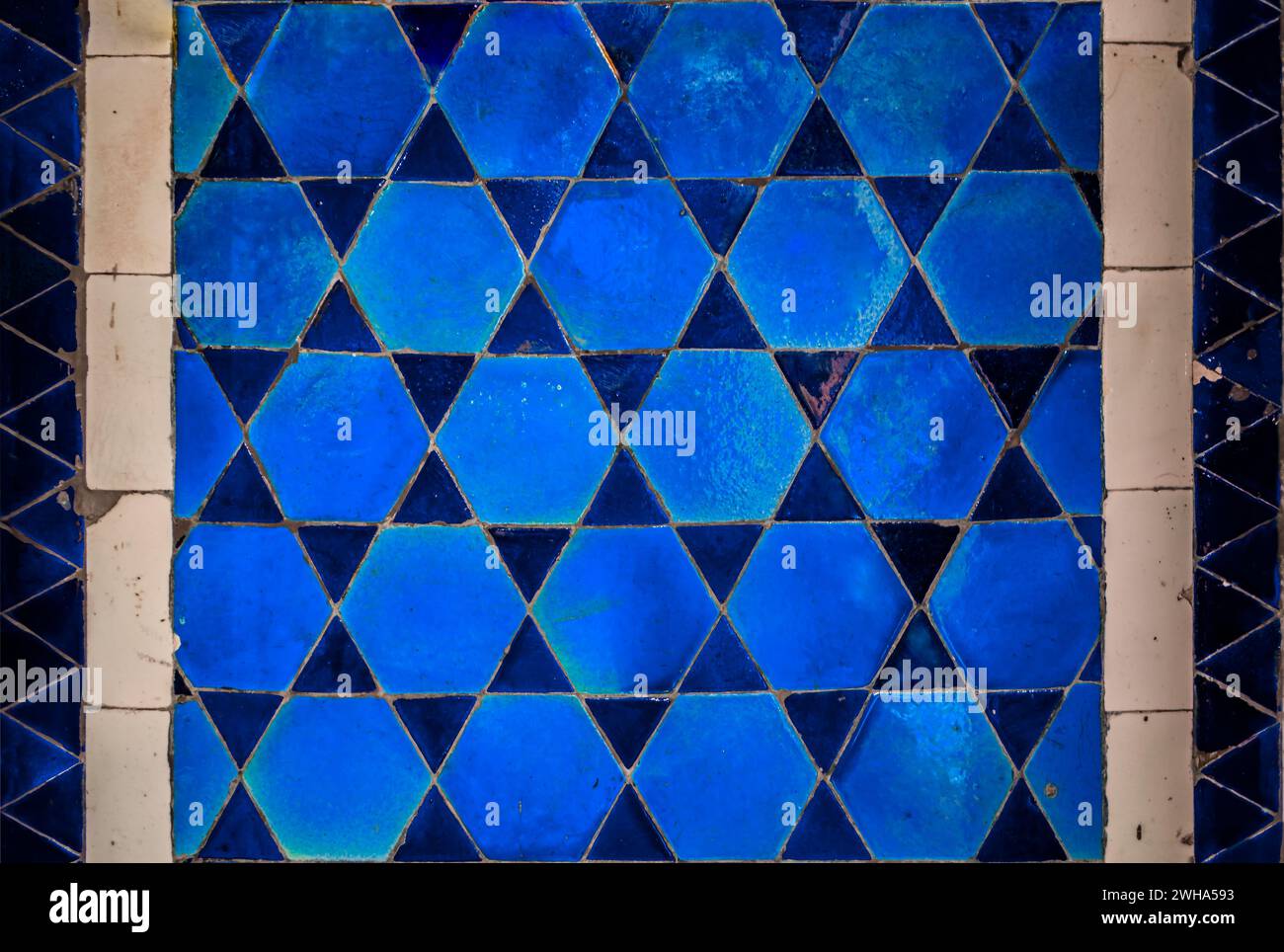 Ornate blue mosaic made of old handmade ceramic tiles in a star pattern ...