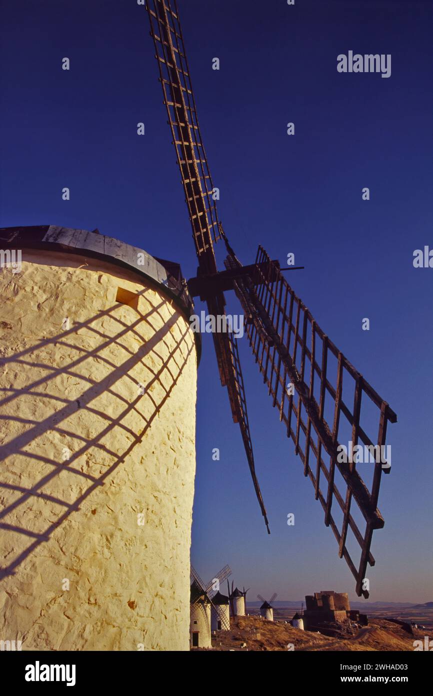 Windmills at Cresteria Manchega hill near Consuegra at sunrise, Castile La Mancha, Spain Stock Photo