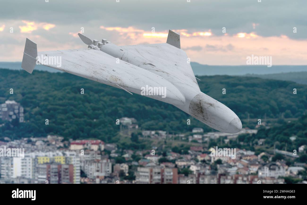 A kamikaze combat drone flies over urban residential buildings, UAV attacks civilian homes and infrastructures, war in Ukraine and Russia. Stock Photo