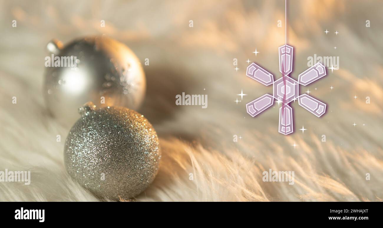 Image of snowflake christmas decorations with baubles on white background Stock Photo