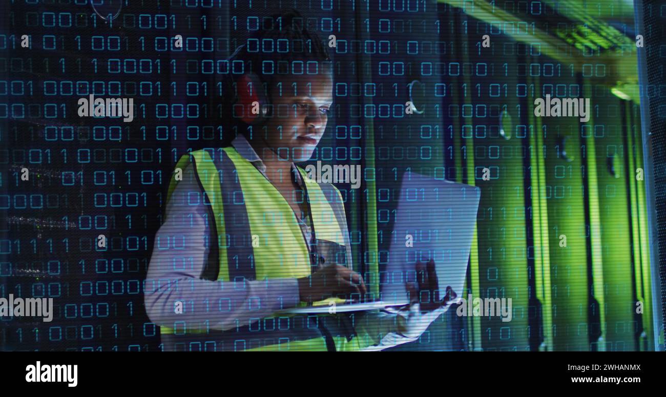 Image of binary coding over african american male it engineer and computer servers Stock Photo