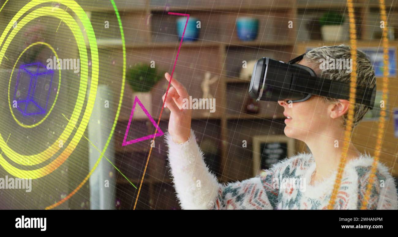 Neon light trails over scope scanner against caucasian woman wearing vr ...