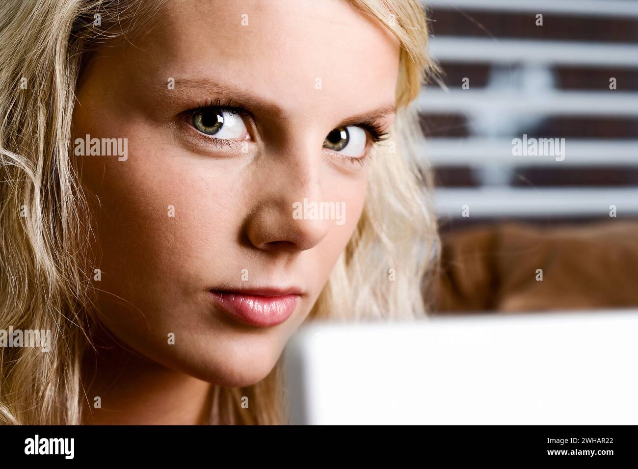 Close-up of a woman with laptop Stock Photo