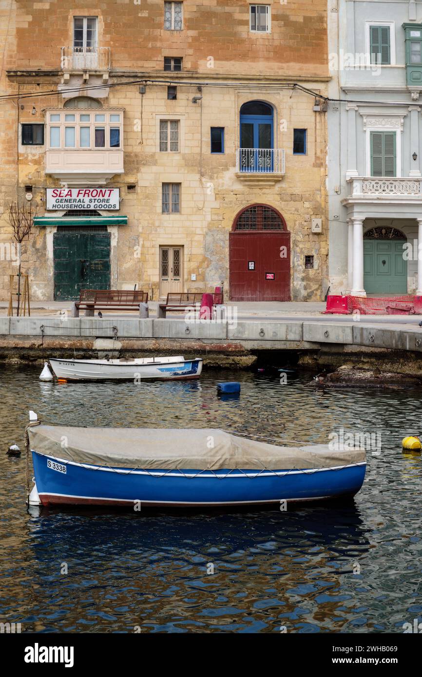 A closed down general store on the waterfront at Kalkara, Valletta, Malta Stock Photo