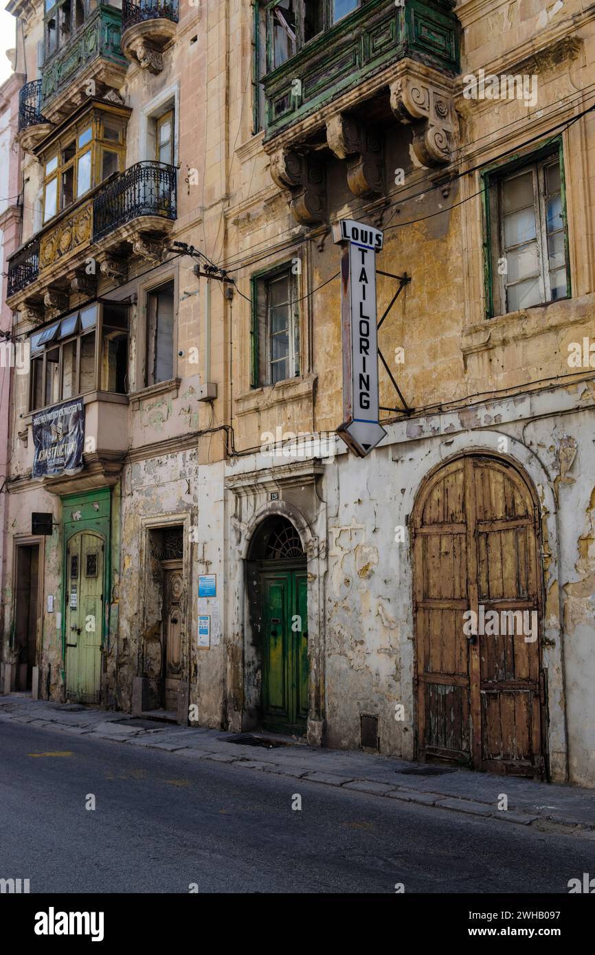 A closed down tailor's business, Senglea, The Three Cities, Valletta, Malta Stock Photo