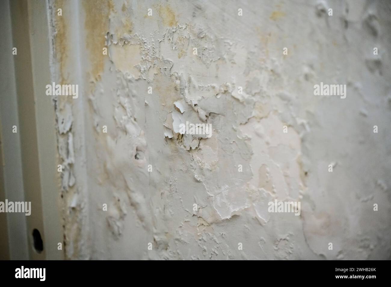 Paint is peeling off an interior wall this was caused by dampness due