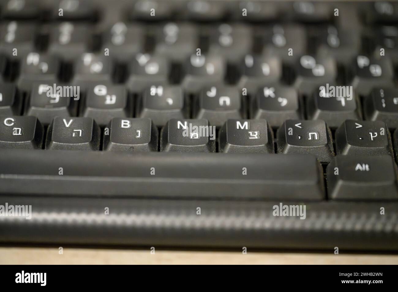 selective focus close up of a Bilingual (English and Hebrew) computer