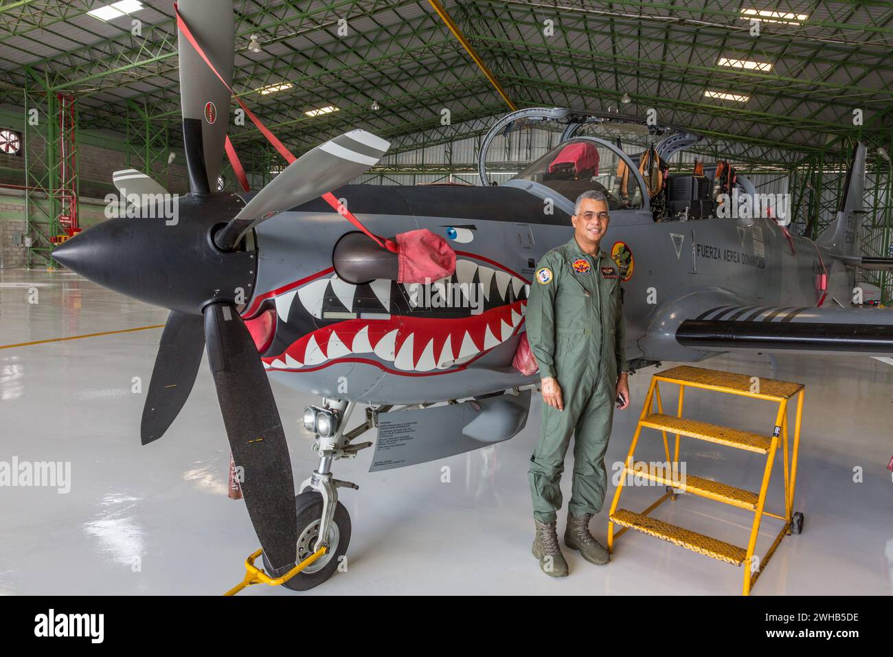 A Dominican Air Force pilot by a Super Tucano fighter aircraft at the San Isidro Air Base in the Dominican Republic. Stock Photo