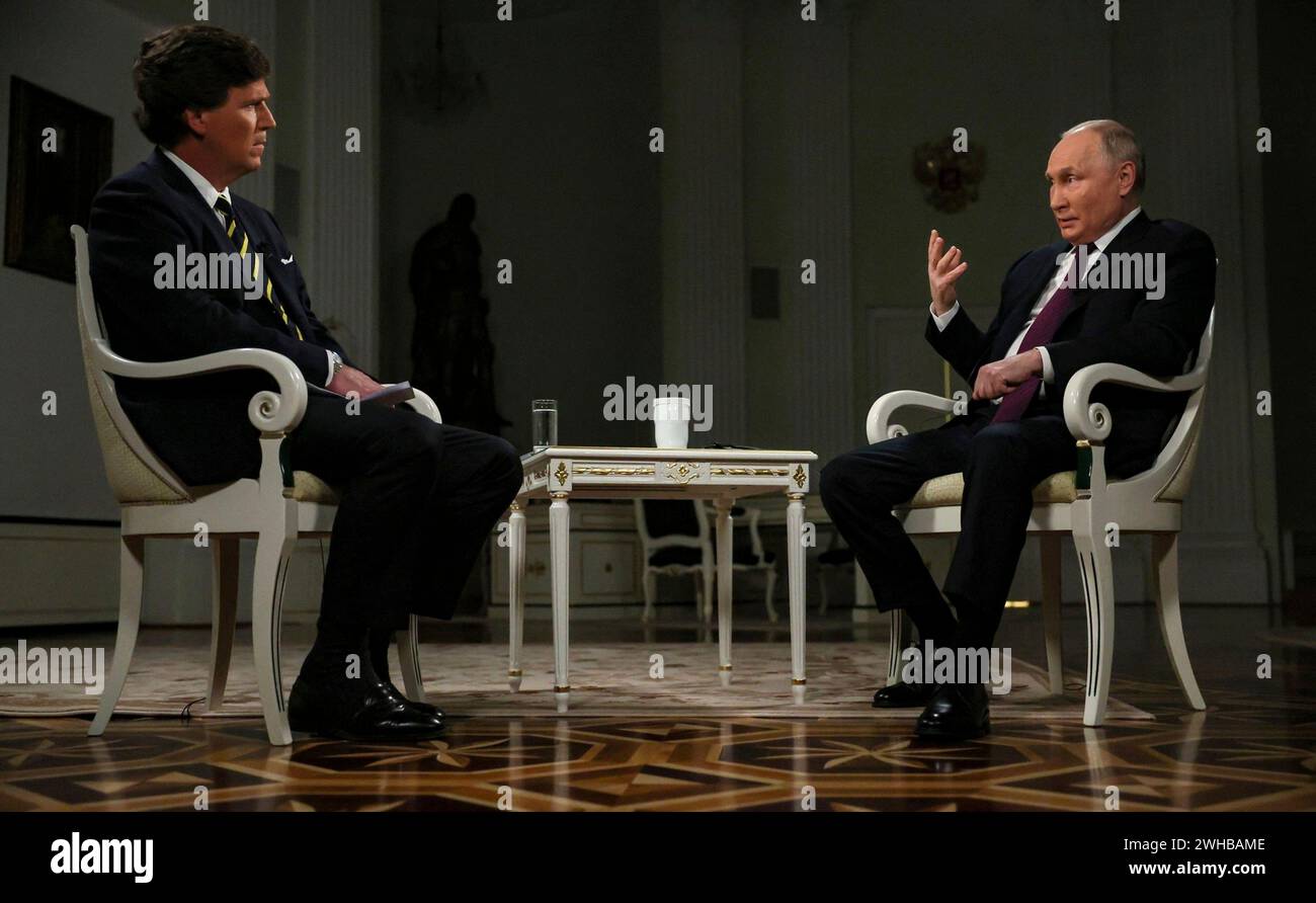 Moscow, Russia. 09th Feb, 2024. Russian President Vladimir Putin, right, responds to a question from conservative television personality Tucker Carlson during an interview at the Kremlin, February 9, 2024 in Moscow, Russia. Credit: Gavriil Grigorov/Kremlin Pool/Alamy Live News Stock Photo