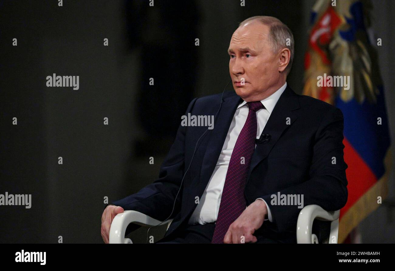 Moscow, Russia. 09th Feb, 2024. Russian President Vladimir Putin, right, listens to a question from conservative television personality Tucker Carlson during an interview at the Kremlin, February 9, 2024 in Moscow, Russia. Credit: Gavriil Grigorov/Kremlin Pool/Alamy Live News Stock Photo