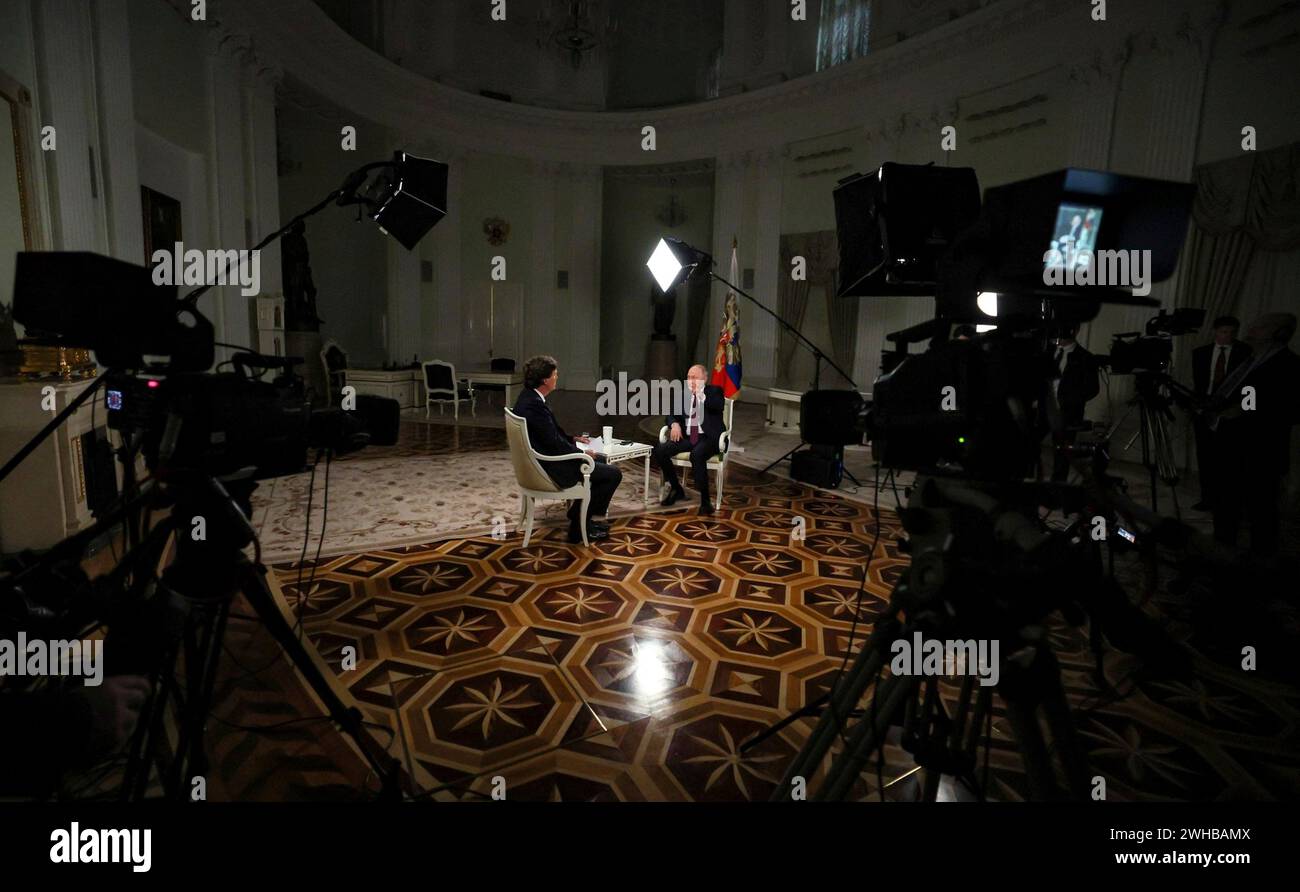 Moscow, Russia. 09th Feb, 2024. Russian President Vladimir Putin, right, responds to a question from conservative television personality Tucker Carlson during an interview at the Kremlin, February 9, 2024 in Moscow, Russia. Credit: Gavriil Grigorov/Kremlin Pool/Alamy Live News Stock Photo