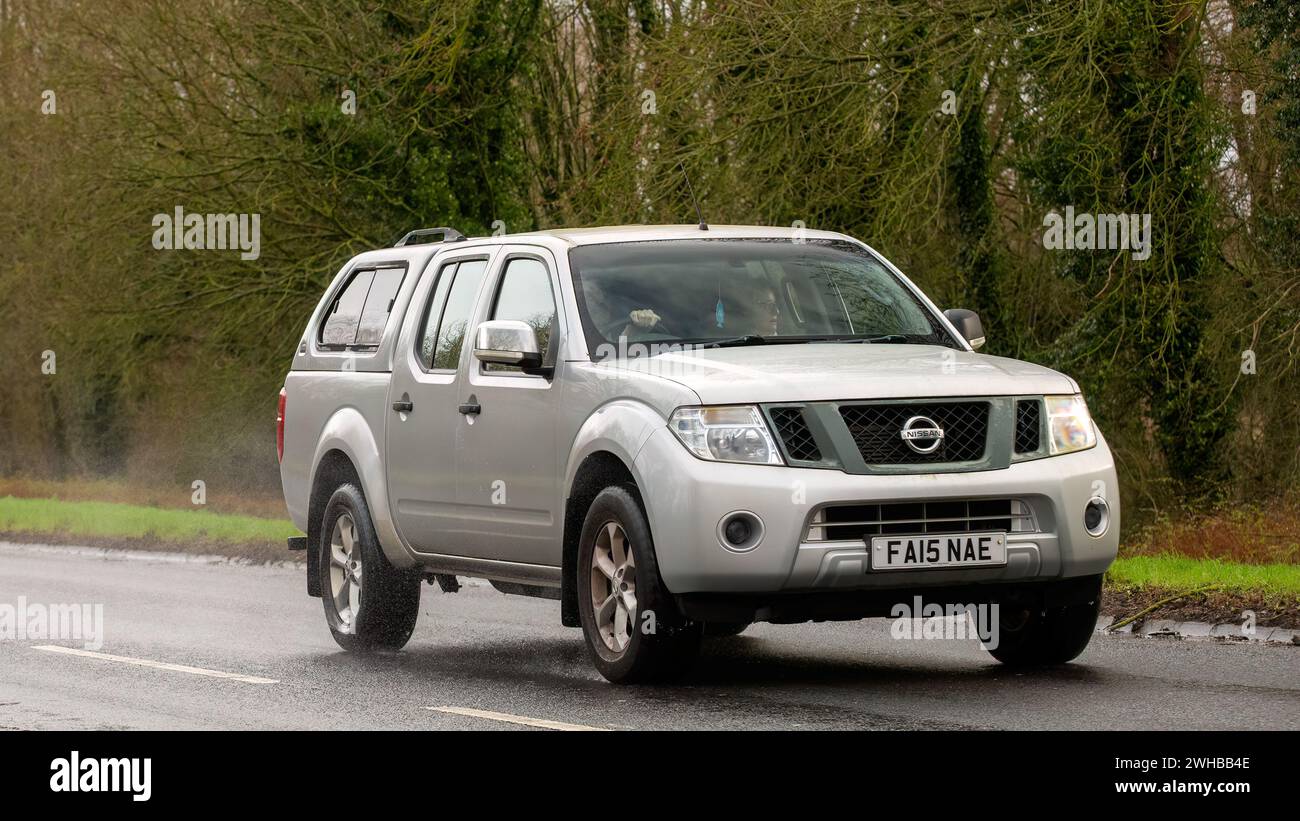 Milton Keynes,UK-Feb 9th 2024: 2015 silver Nissan Navara car  driving on an English road Stock Photo