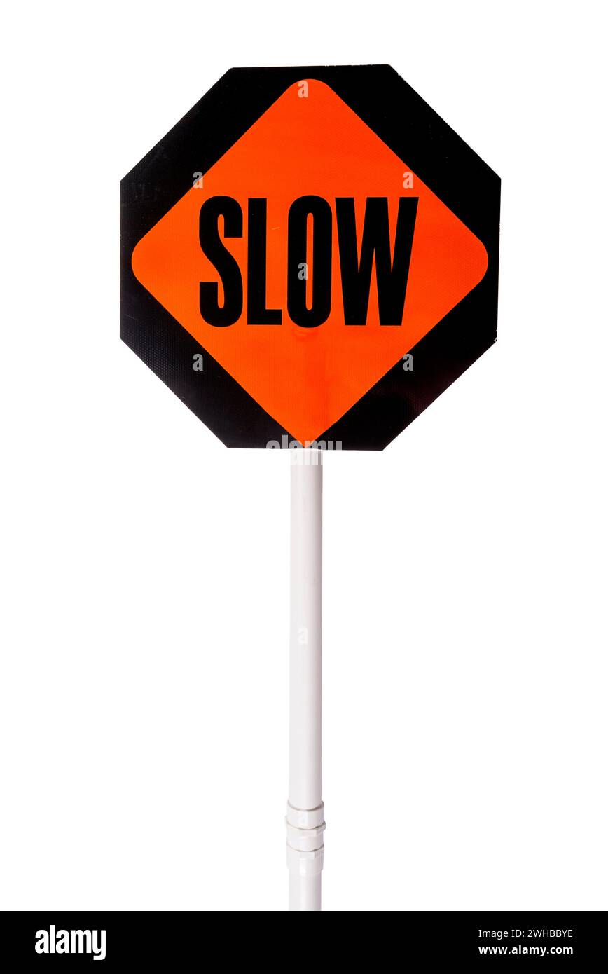 Hand held slow sign for safety in construction zones Stock Photo