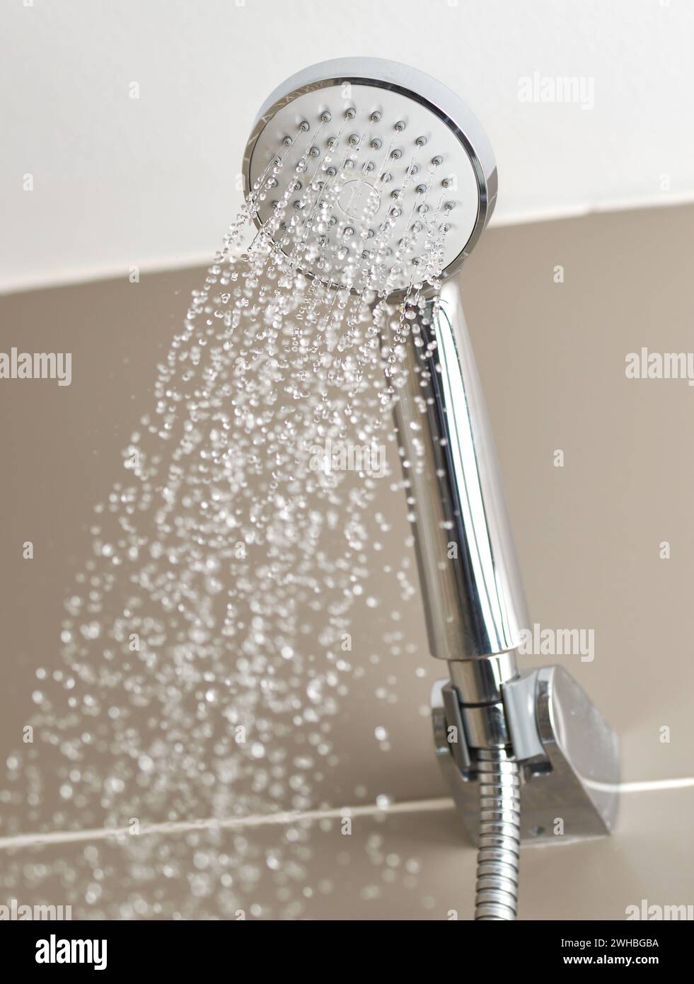 Close up of shower head flowing water Stock Photo