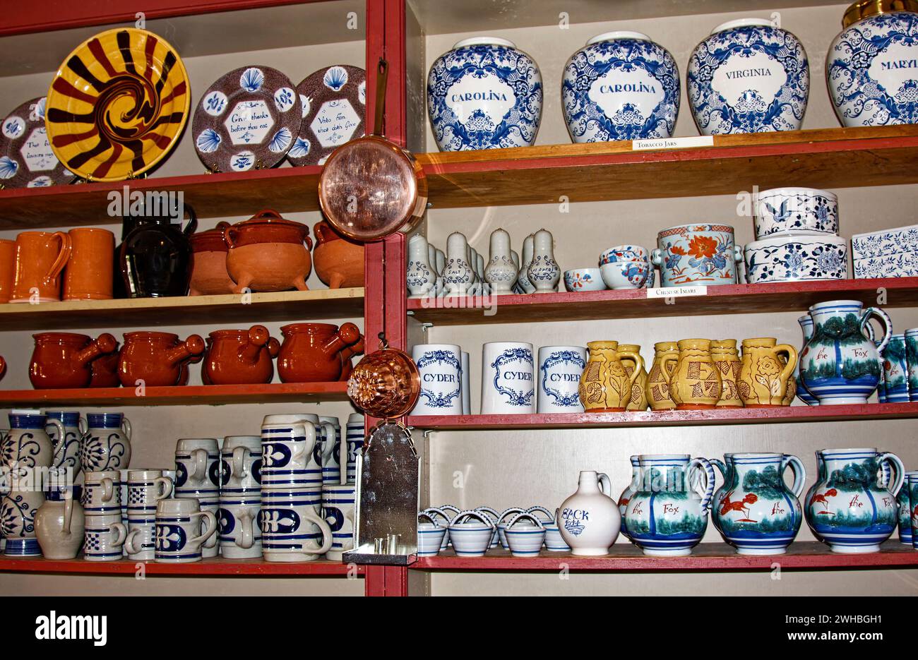 gift shop, ceramics, metal household objects, hand crafted, shelves of merchandise, for sale, Colonial Williamsburg; Virginia; Williamsburg; VA Stock Photo