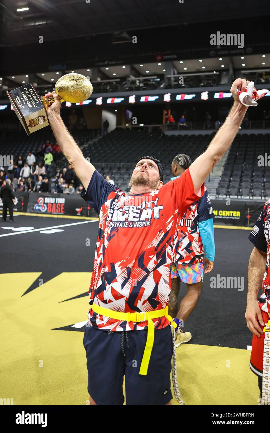 Henderson, NV, USA. 08th Feb, 2024. Actor Kevin Dillon poses with the championship trophy and the MVP trophy at the conclusion of the 24th annual Celebrity Flag Football Challenge at the Dollar Loan Center in Henderson, NV. Christopher Trim/CSM/Alamy Live News Stock Photo