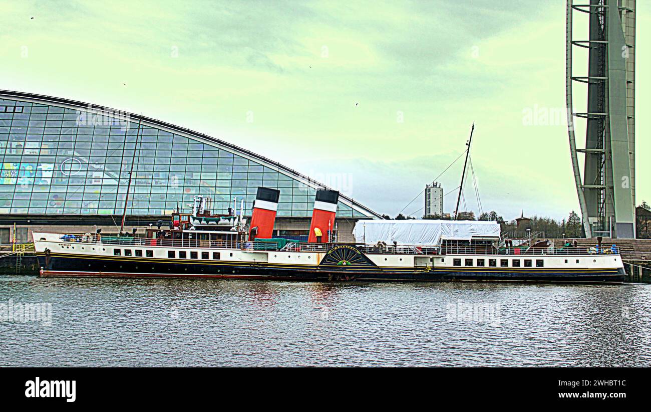 Glasgow, Scotland, UK. 9tht February, 2024.  Cloudy riverside and Dancing wave the longest mural in the city celebrates the heritage of the river clyde and runs along its bank illustrating its sites and history where the paddlesteamer waverley is moored beside the science centre. Credit Gerard Ferry/Alamy Live News Stock Photo