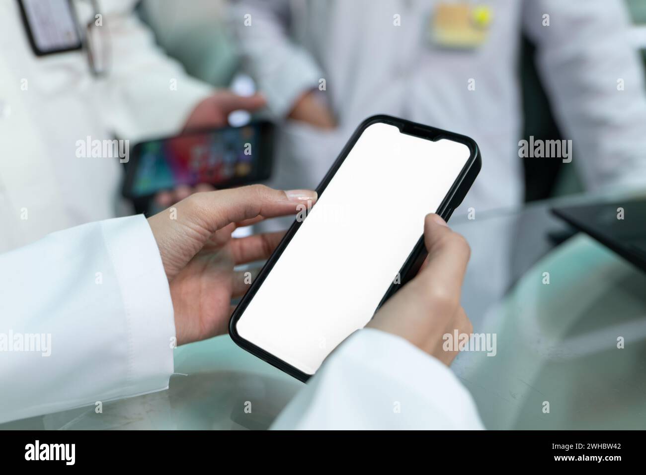 Doctors are pointing on smartphone Stock Photo