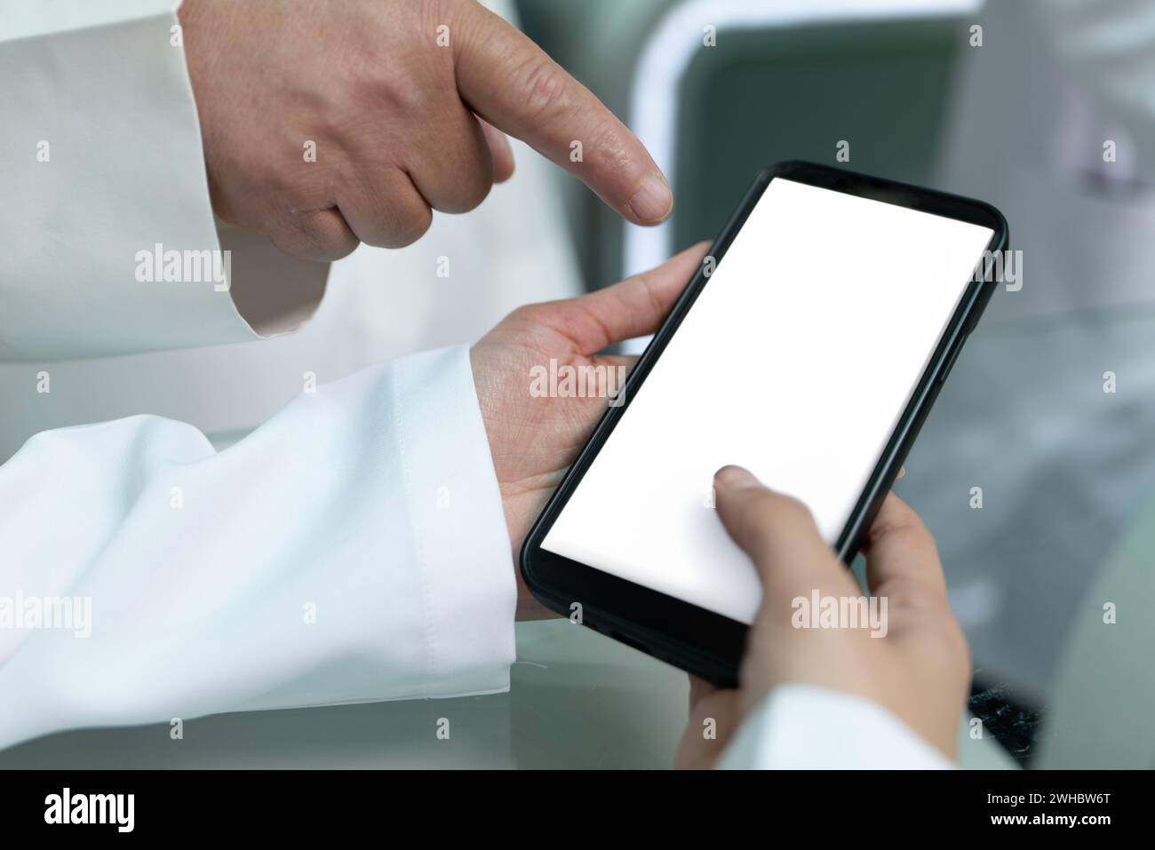Doctors are pointing on smartphone Stock Photo