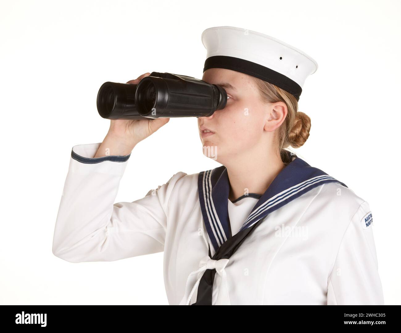 Young sailor with binoculars isolated white background Stock Photo - Alamy