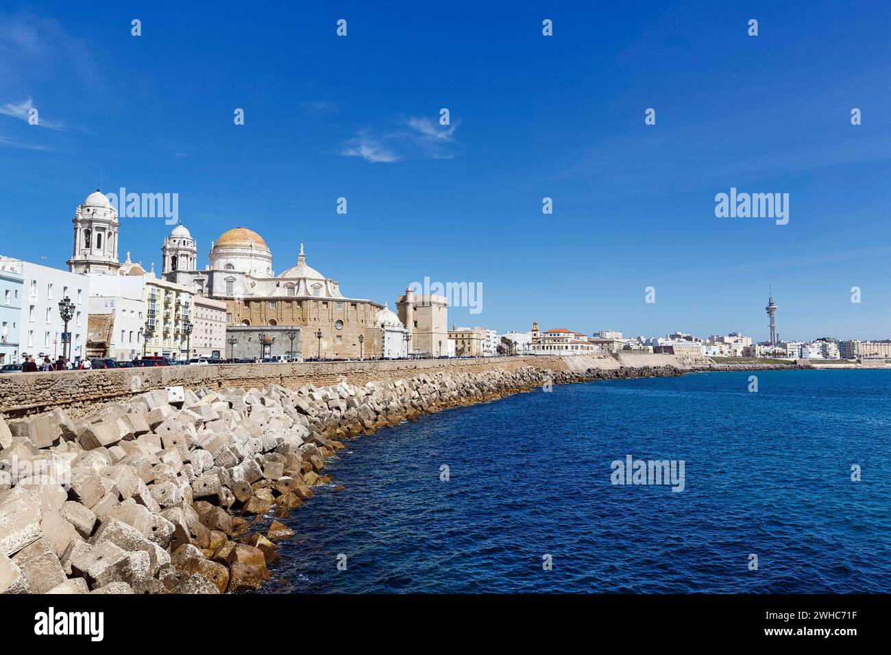 View of the dome and steeples of Cadiz Cathedral, Cathedral of the Holy Cross above the sea, seafront promenade, Cadiz, Andalusia, Spain Stock Photo