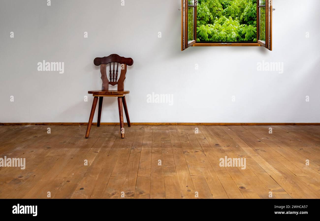Old room with rustic wooden chair Stock Photo