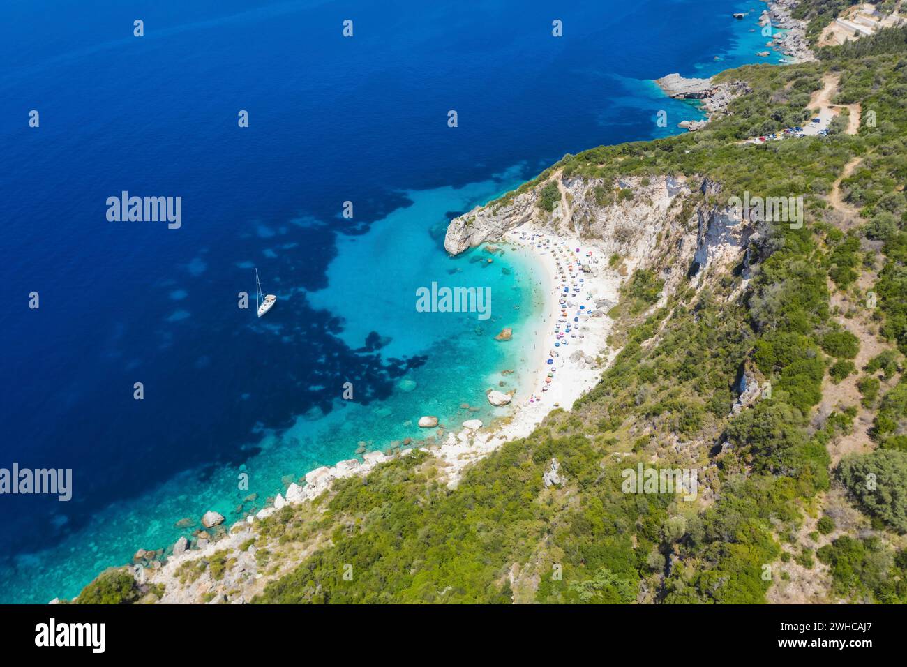 Aerial drone photo of iconic paradise sandy beach of Agiofili near port of Vasiliki with emerald crystal clear sea and sail boats docked, Lefkada island, Ionian, Greece. Stock Photo