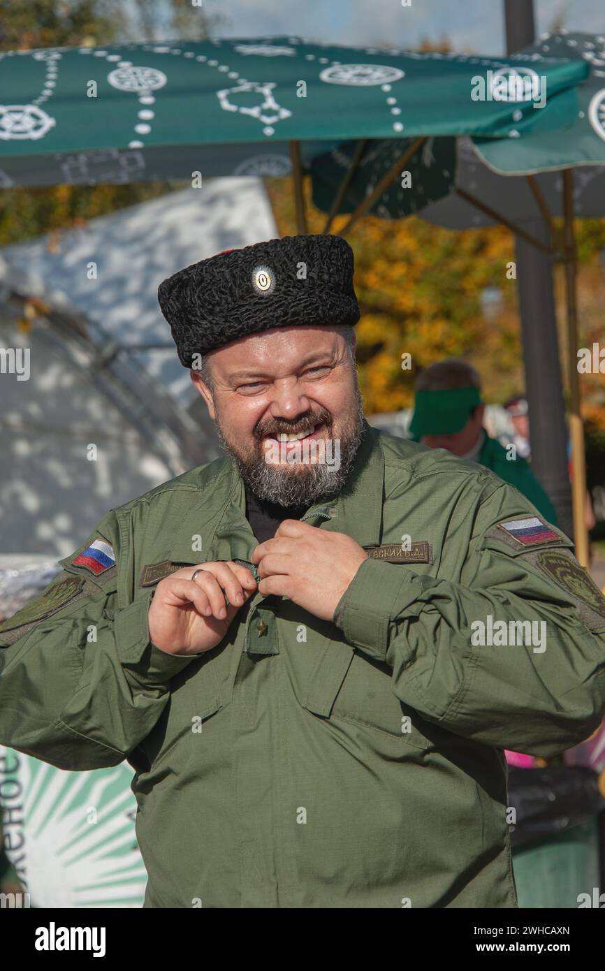 Moscow, Russia October 1, 2016: Cossack gathering. Portrait of a cheerful cheerful middle-aged gray-haired Cossack with a beard and wearing a papakha. Stock Photo