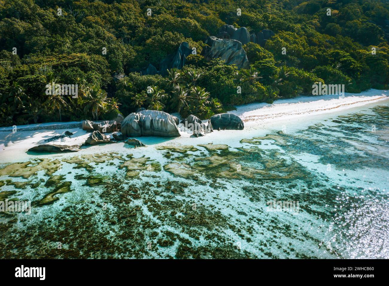 Anse Source d'Argent beach at La Digue island, Seychelles from drone aerial perspective. Stock Photo