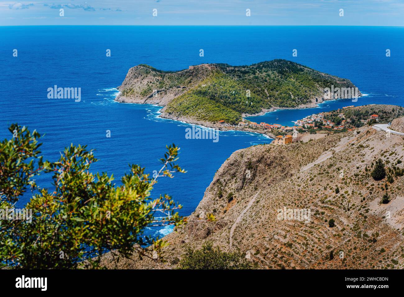 Picturesque view of sunny Assos village and blue sea bay. Kefalonia island, Greece. Stock Photo