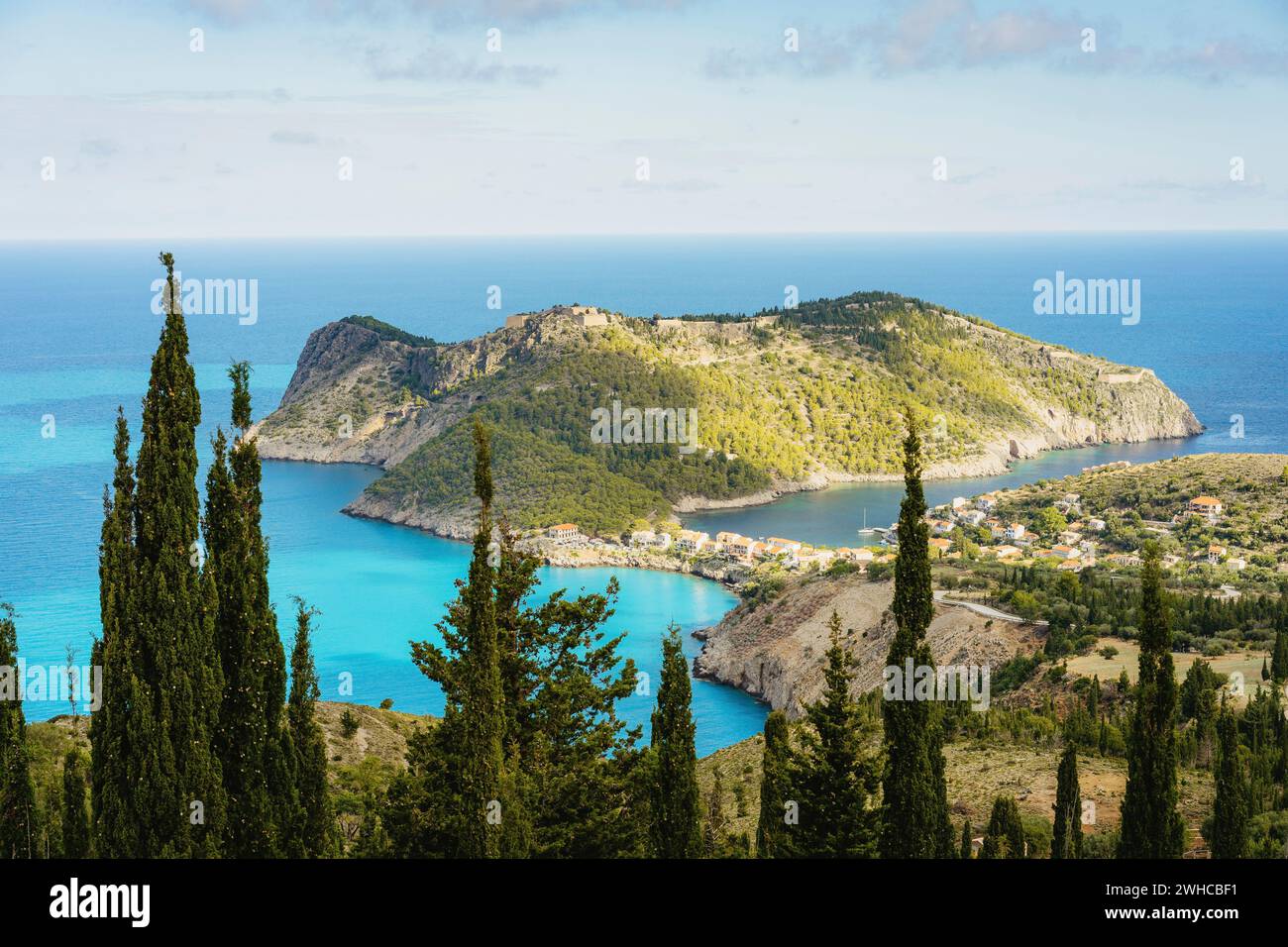 View to famous Assos village and venetian fortress, beautiful seashore scenery, Kefalonia island, Greece wonder miracle of nature. Stock Photo