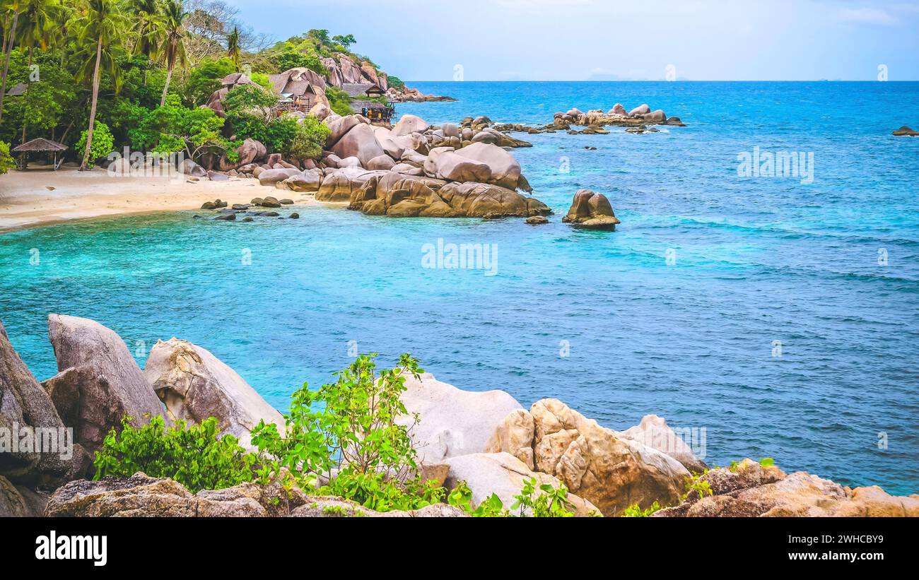 Costline of Koh Tao Islands in Thailand. Granite Rocks and blue lagoon with clear sea water. Stock Photo