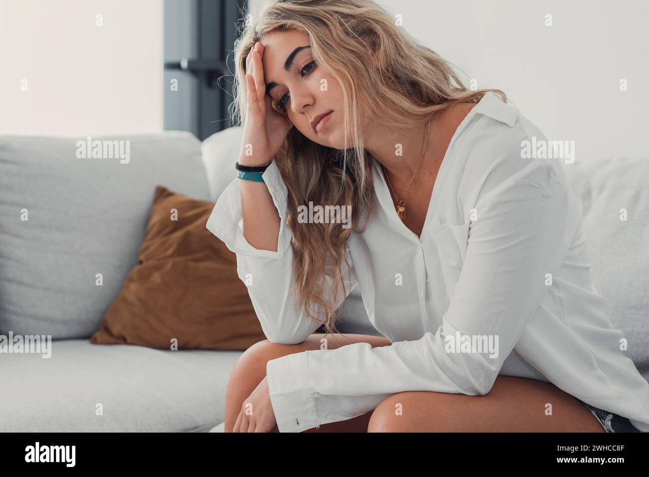 Close up tired woman after long sedentary work, exhausted girl feeling discomfort, unwell and unhealthy Stock Photo
