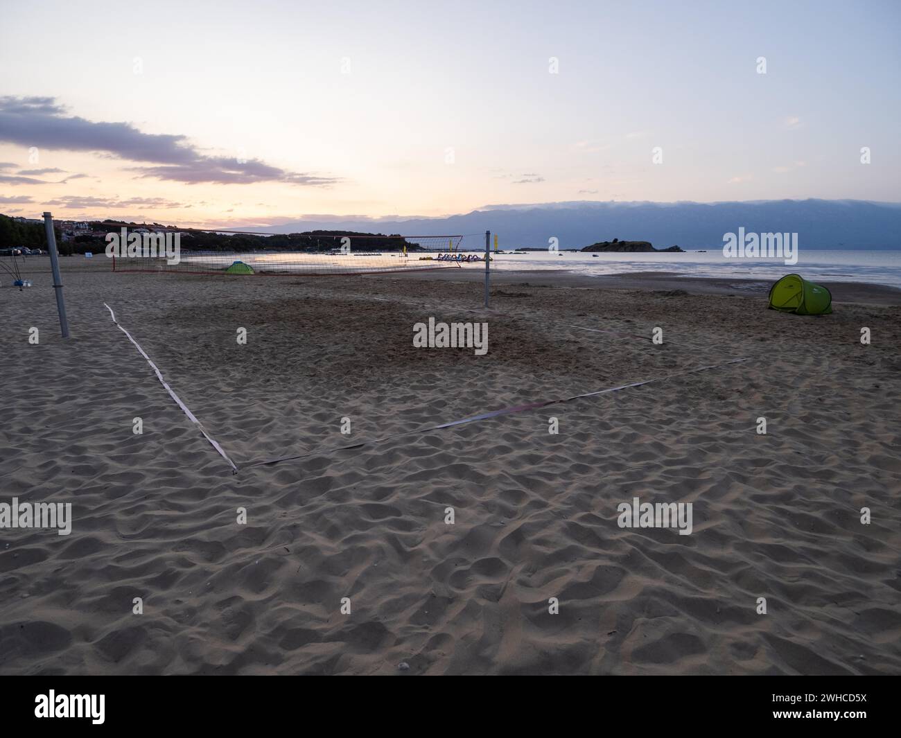 Morning atmosphere on the beach at sunrise, beach volleyball court, Lopar, island of Rab, Kvarner Gulf Bay, Croatia Stock Photo