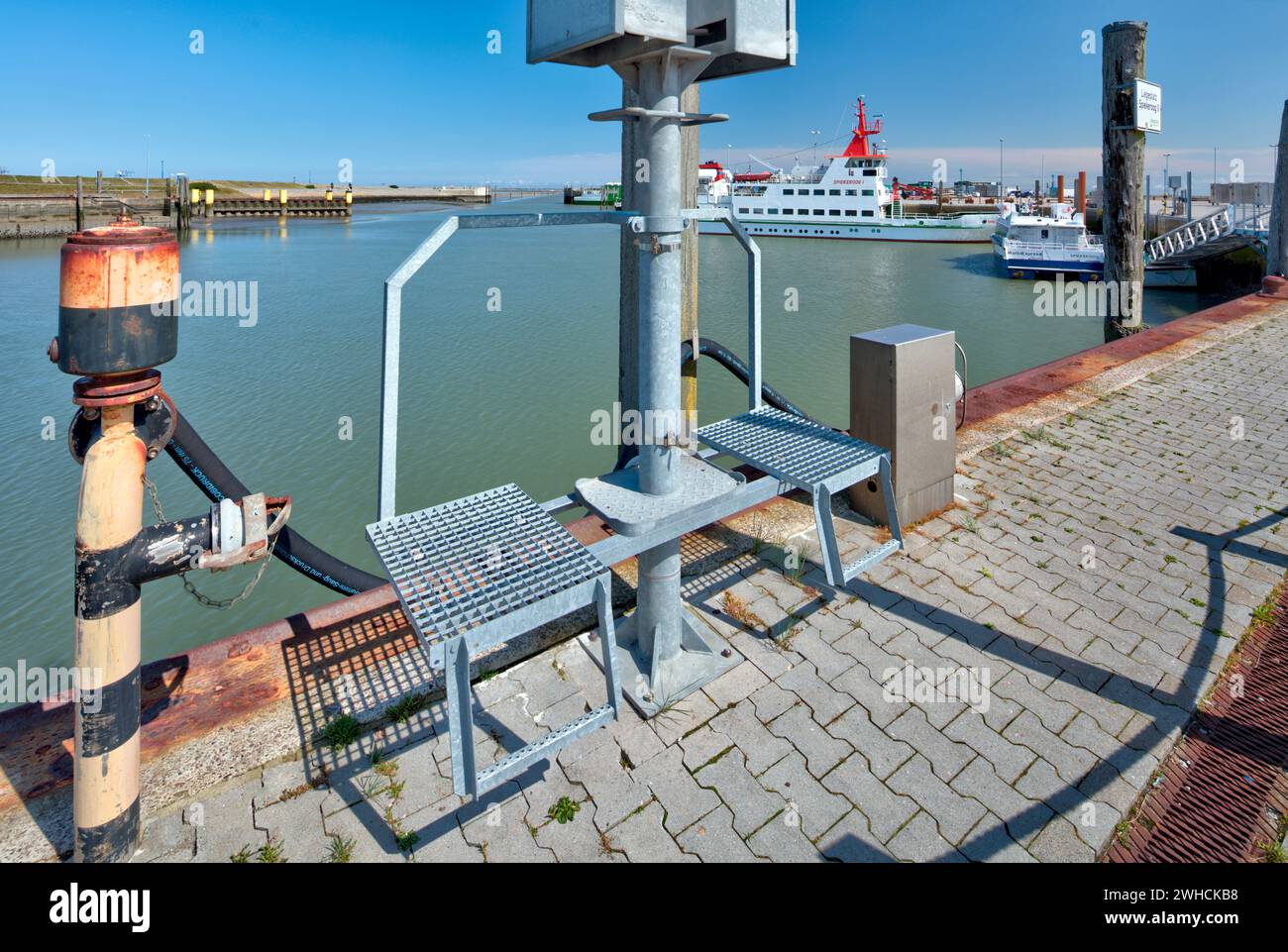 Berth, jetty, Spiekeroog, ferry, harbor, pier, view of town, Neuharlingersiel, East Frisia, North Sea, Germany, Stock Photo