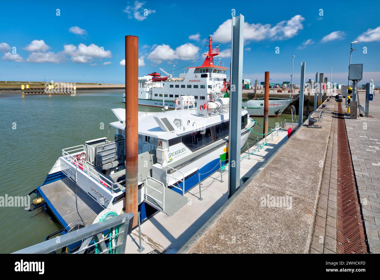 Berth, jetty, Spiekeroog, ferry, harbor, pier, view of town, Neuharlingersiel, East Frisia, North Sea, Germany, Stock Photo