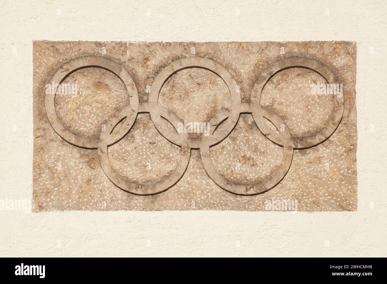 Olympic rings at the Olympic Stadium, 1936 venue of the Winter Games, torchbearer, Garmisch-Partenkirchen, Upper Bavaria, Bavaria, Germany Stock Photo