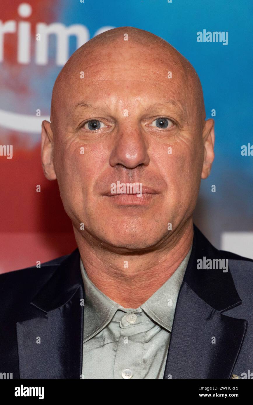 Tomi May poses for photographers upon arrival at the premiere for the