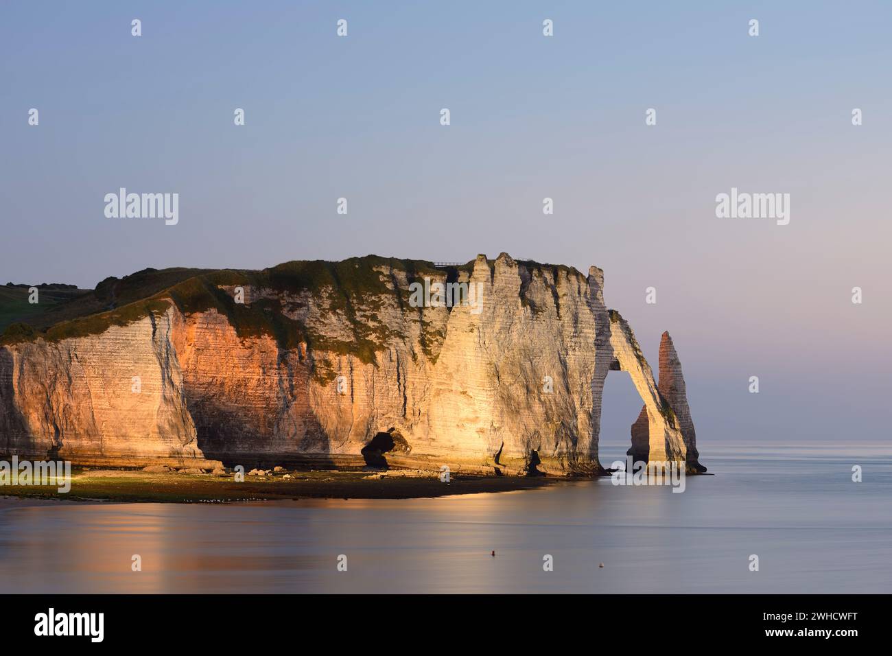 Steep cliffs with the Falaise d'Aval rock gate and the Aiguille ...